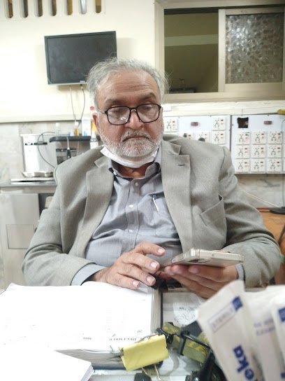 Dr Munir Sheikh